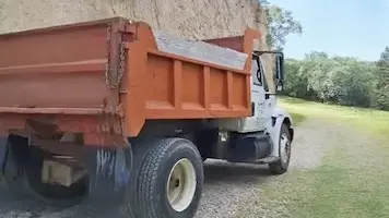 Kenny D's dump truck hauling a load in Council Bluffs, Iowa