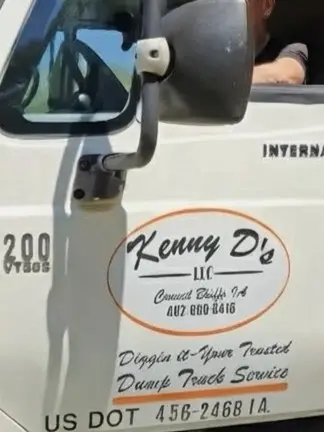 Kenny D's LLC name and USDOT information displayed on the truck door